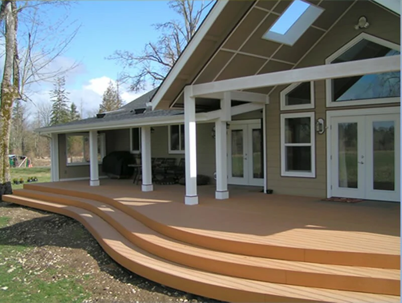 Full view of custom home and covered deck by Foley Construction